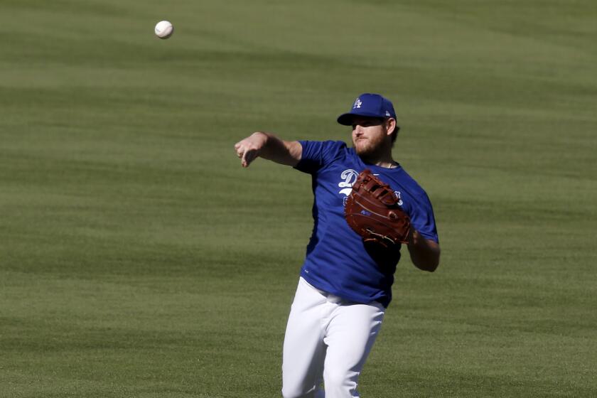 LOS ANGELES, CALIF. - JULY 3, 2020. Dodgers first basemn Max Muncy wrms up during practice at Dodger Stadium on Friday, July 3, 2020. (Luis Sinco/Los Angeles Times)