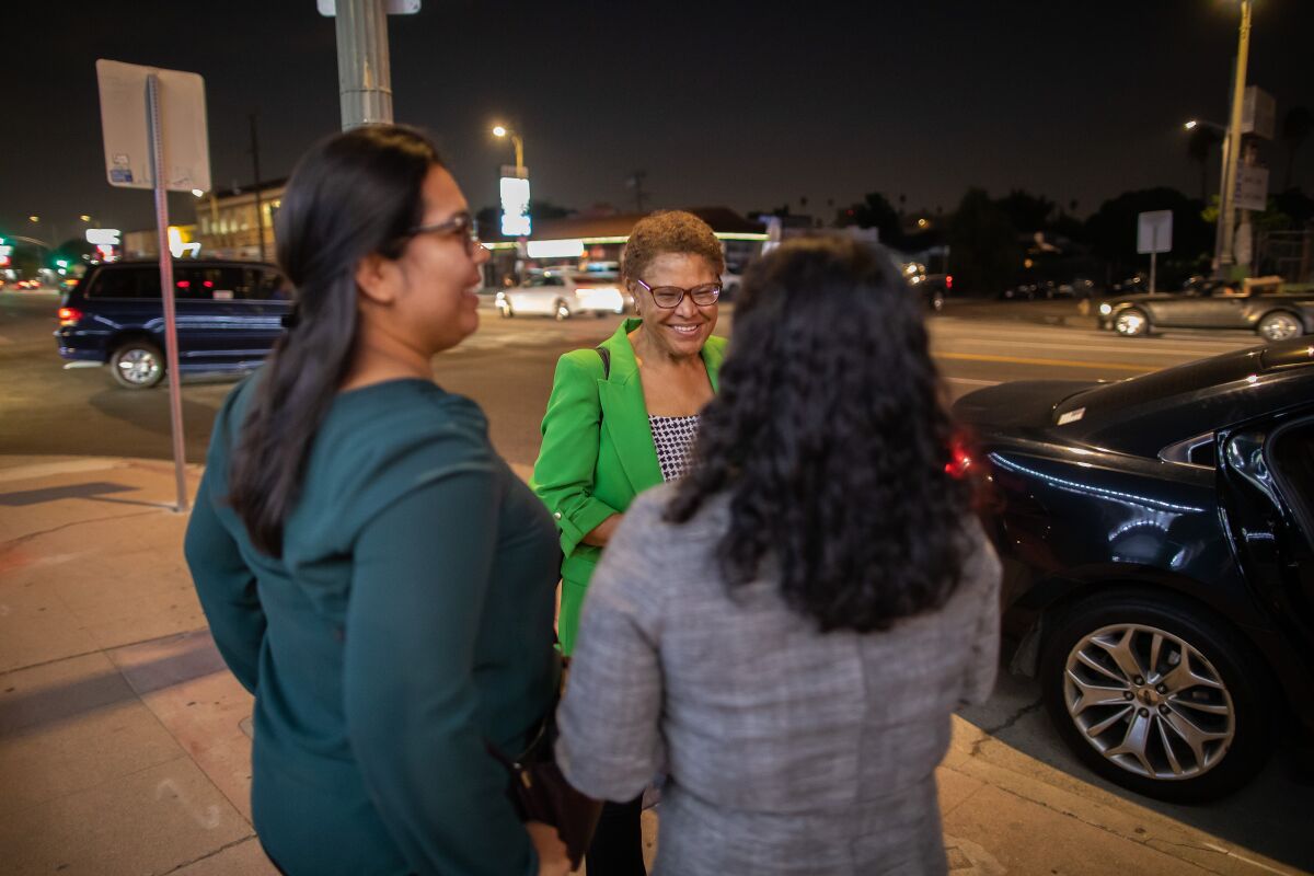 L.A. mayoral candidate Karen Bass' Latino-Black family versus the ugly city council audiotape 4 A smiling woman with two other women on a sidewalk.