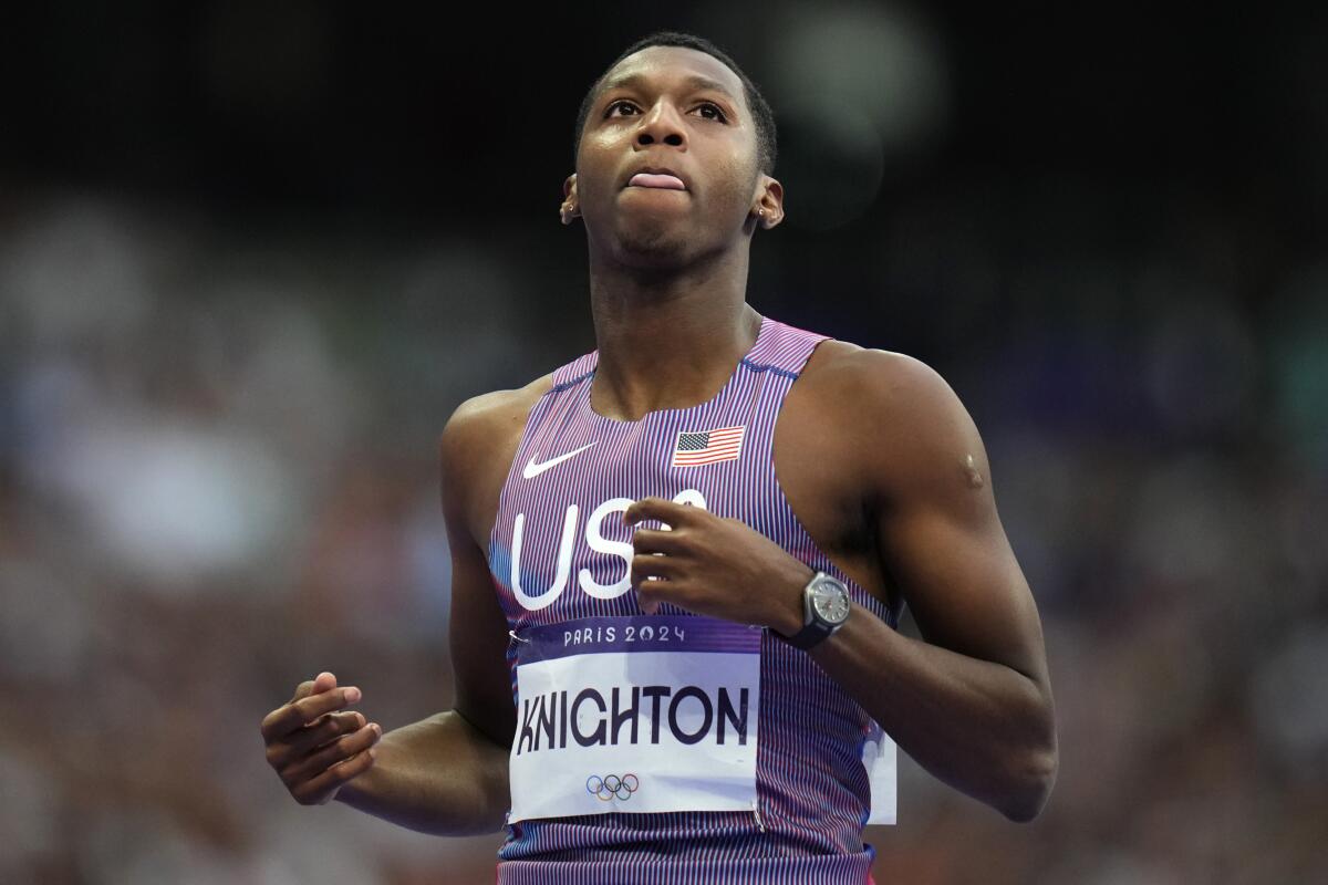 Erriyon Knighton runs at the Paris Olympics.