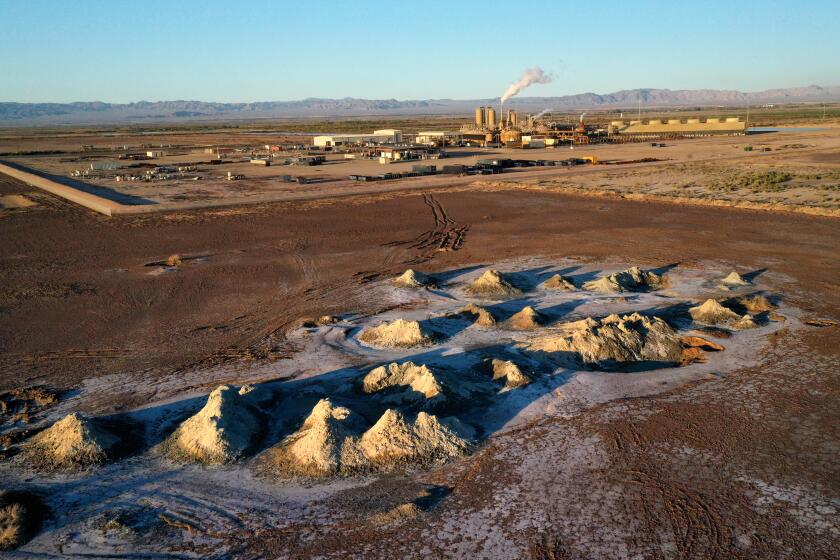 CALIPATRIA, CALIFORNIA--SEPT. 27, 2019--Mounds of dirt are areas of hot water bubbling up next to the geothermal power plant owned by EnergySource. EnergySource is a company that produces geothermal energy near the Salton Sea and the town of Calipatria, California. For decades, geothermal power plant operators in the area have been trying to find a cost-effective way to extract lithium and other valuable minerals from the super-heated brine they run through their pipes to generate electricity. Now EnergySourse says it has finally solved the puzzle. A huge new source of lithium could help fuel the growth of electric vehicles, and could also improve the economic fortunes of the geothermal industry. It will become the largest commercial producer of lithium in the United State. (Carolyn Cole/Los Angeles Times)