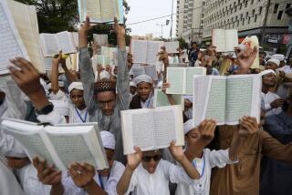 Children hold copies of Islam's holy book Quran during a demonstration in Karachi, Pakistan, Thursday, July 6, 2023, organized by an religious group against the desecration of Islam's holy book Quran that took place in Sweden. (AP Photo/Fareed Khan)