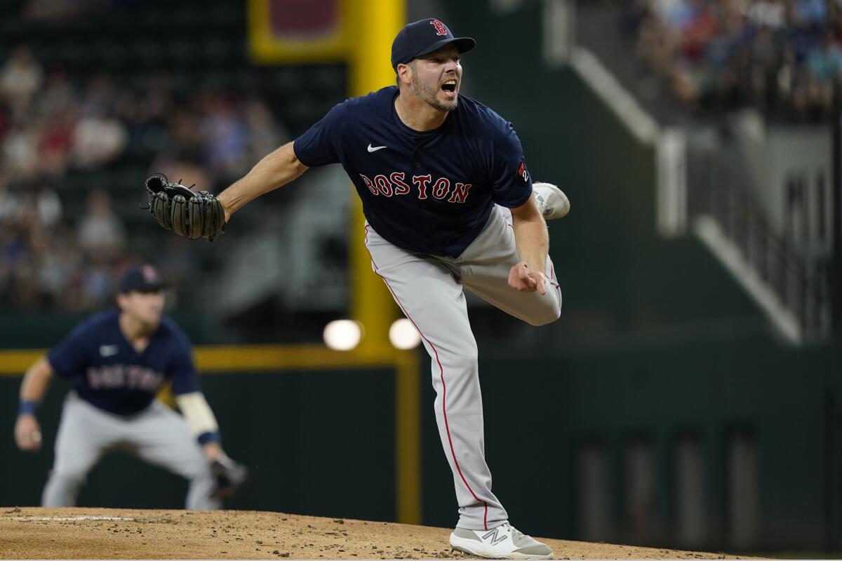 Boston Red Sox starting pitcher Rich Hill throws during the first inning of a baseball game against the Texas Rangers in Arlington, Texas, Saturday, May 14, 2022. (AP Photo/LM Otero)