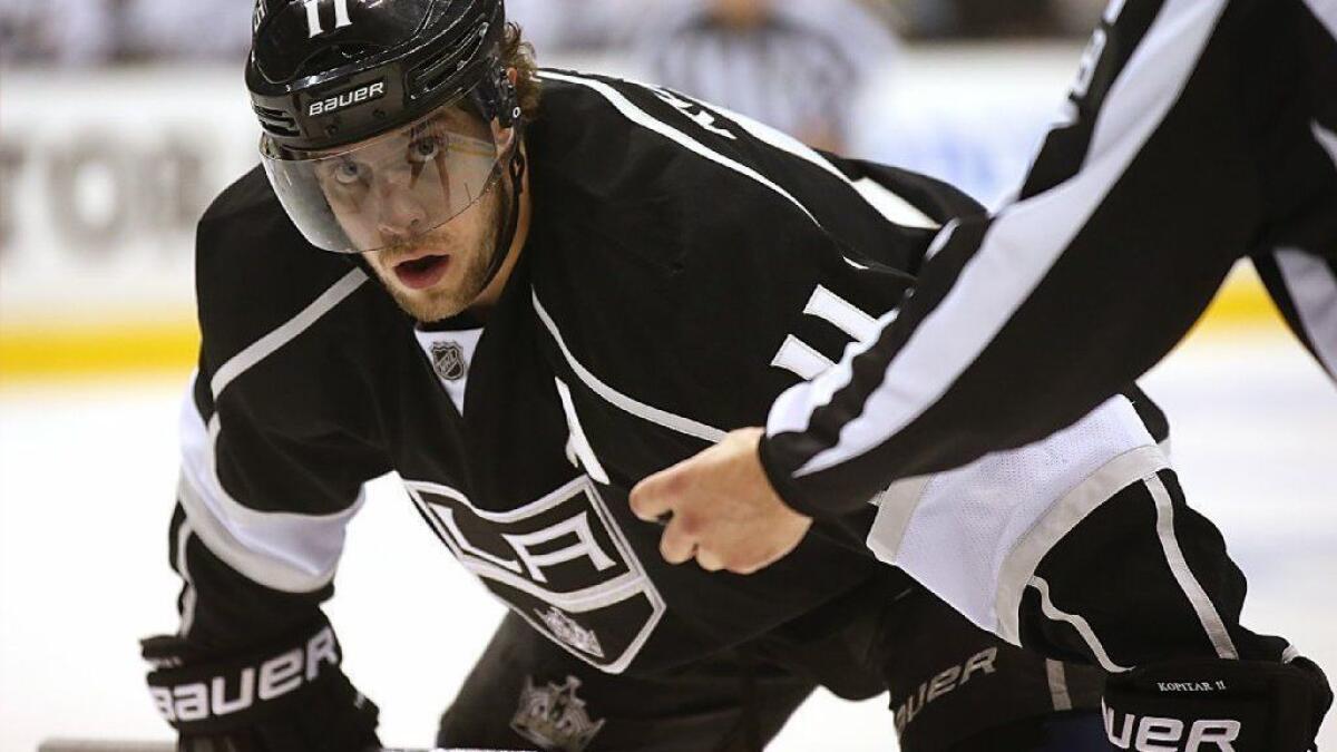 Kings center Anze Kopitar faces off against the San Jose Sharks in a 2014 game at Staples Center. The Kings will take on the Sharks in their regular season opener.