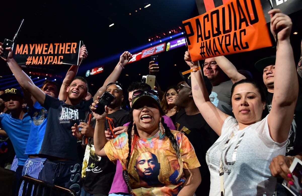 Manny Pacquiao and Floyd Mayweather fans show their support as they await the start of Friday's weigh-in in Las Vegas.