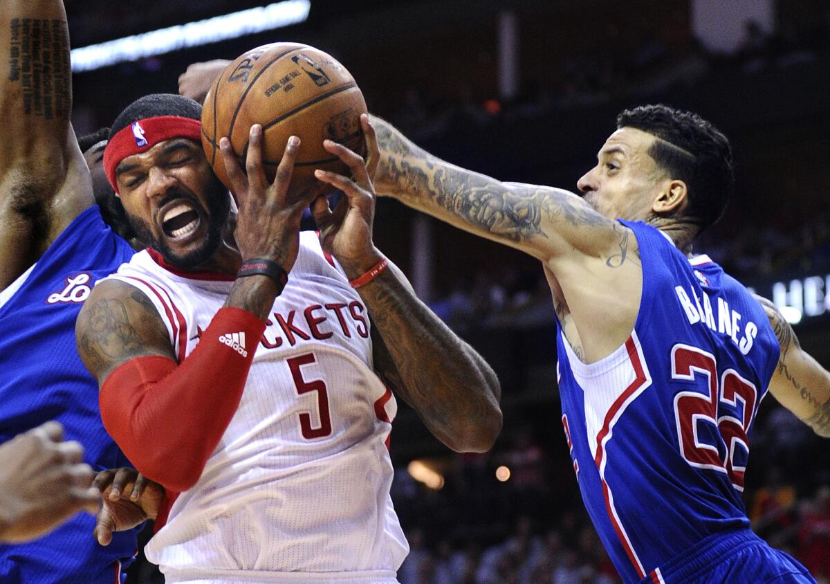 Clippers forward Matt Barnes blocks the shot of Rockets forward Josh Smith in the fourth quarter of Game 1. The Clippers won 117-101.