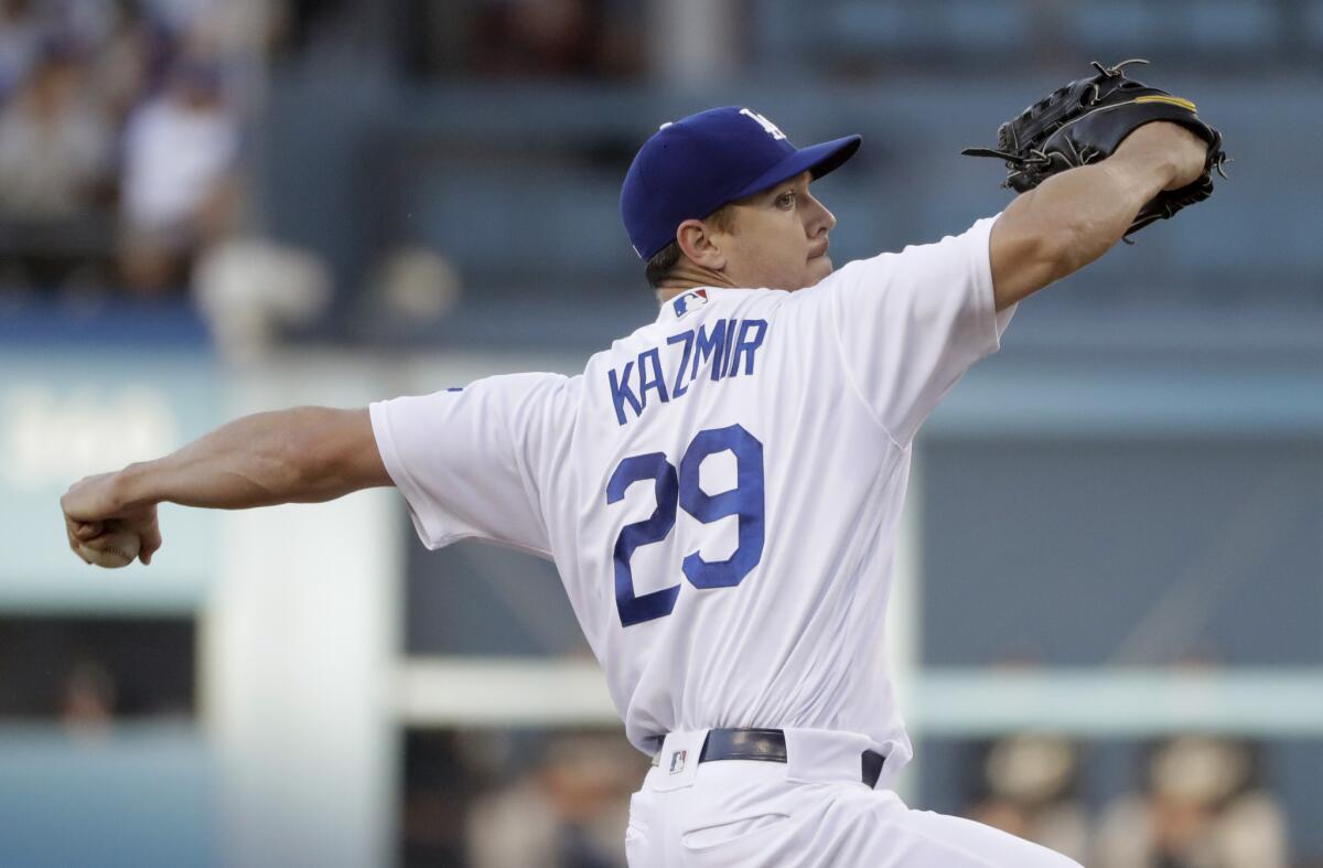 Dodgers starting pitcher Scott Kazmir throws in the first inning against the Colorado Rockies July 2.