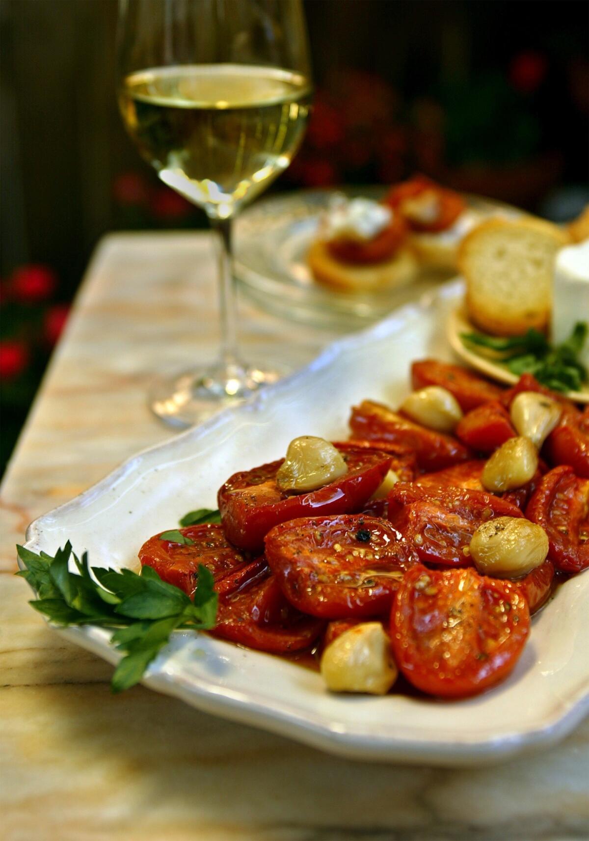 Recipe: Crostini with roasted tomatoes and goat cheese.