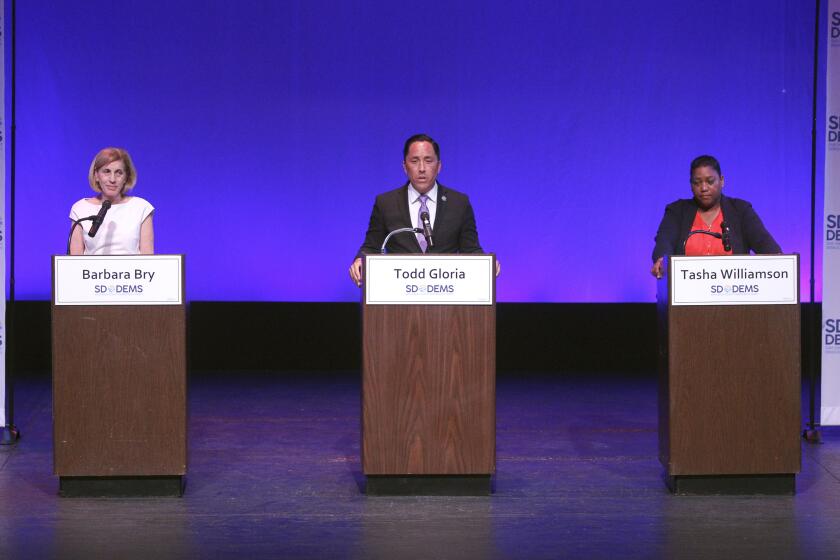 Democratic candidates for the San Diego's mayors race, Barbara Bry, Todd Gloria, and Tasha Williamson, stand on stage during the San Diego Mayoral Candidates Forum, hosted by the San Diego Democratic Party, at the Saville Theatre at San Diego City College on Friday, August 9, 2019 in San Diego, California.
