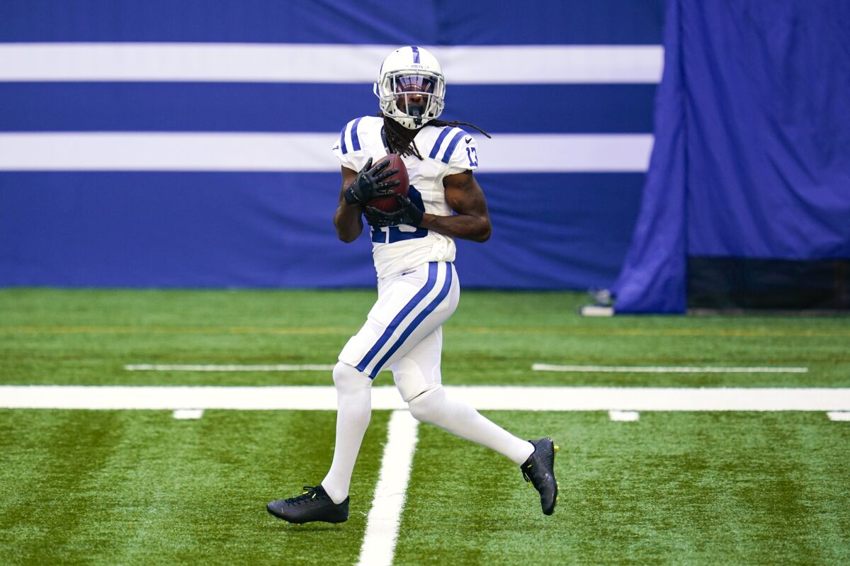 Indianapolis Colts wide receiver T.Y. Hilton (13) makes a catch during practice at the NFL team's football training camp at Lucas Oil Stadium in Indianapolis, Monday, Aug. 24, 2020. (AP Photo/Michael Conroy)