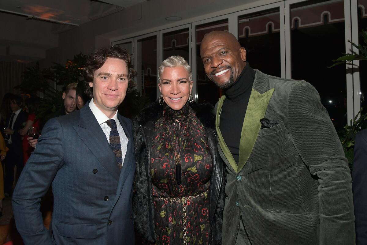 Esquire editor in chief Jay Fielden, left, wearing Hugo Boss, Rebecca King-Crews and Terry Crews attend Esquire's "Mavericks of Hollywood" party in West Hollywood.