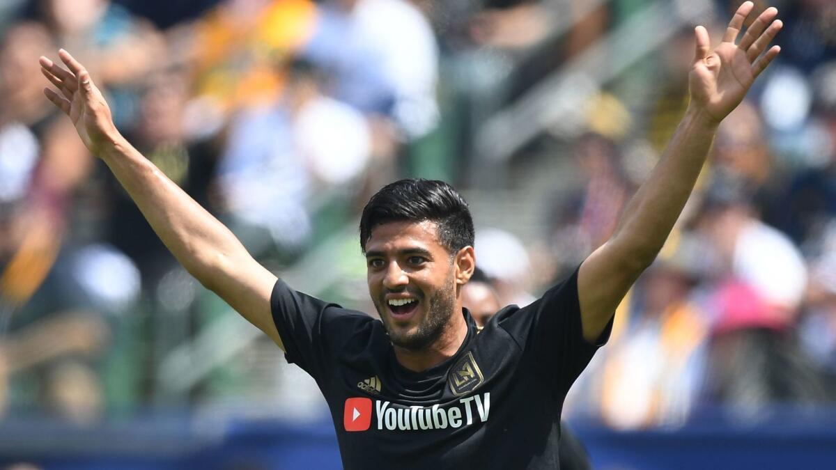 Carlos Vela celebrates after scoring against the Galaxy during an MLS game last season.