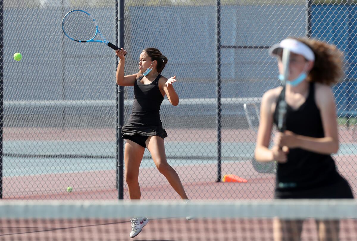 Kana Byrd, left, is shown competing in doubles for the Sage Hill School girls' tennis team last spring. 