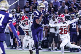 Kuika Moaalii, a 6-foot-5 sophomore, makes tough catch for St. John Bosco. He had four catches for 119 yards.