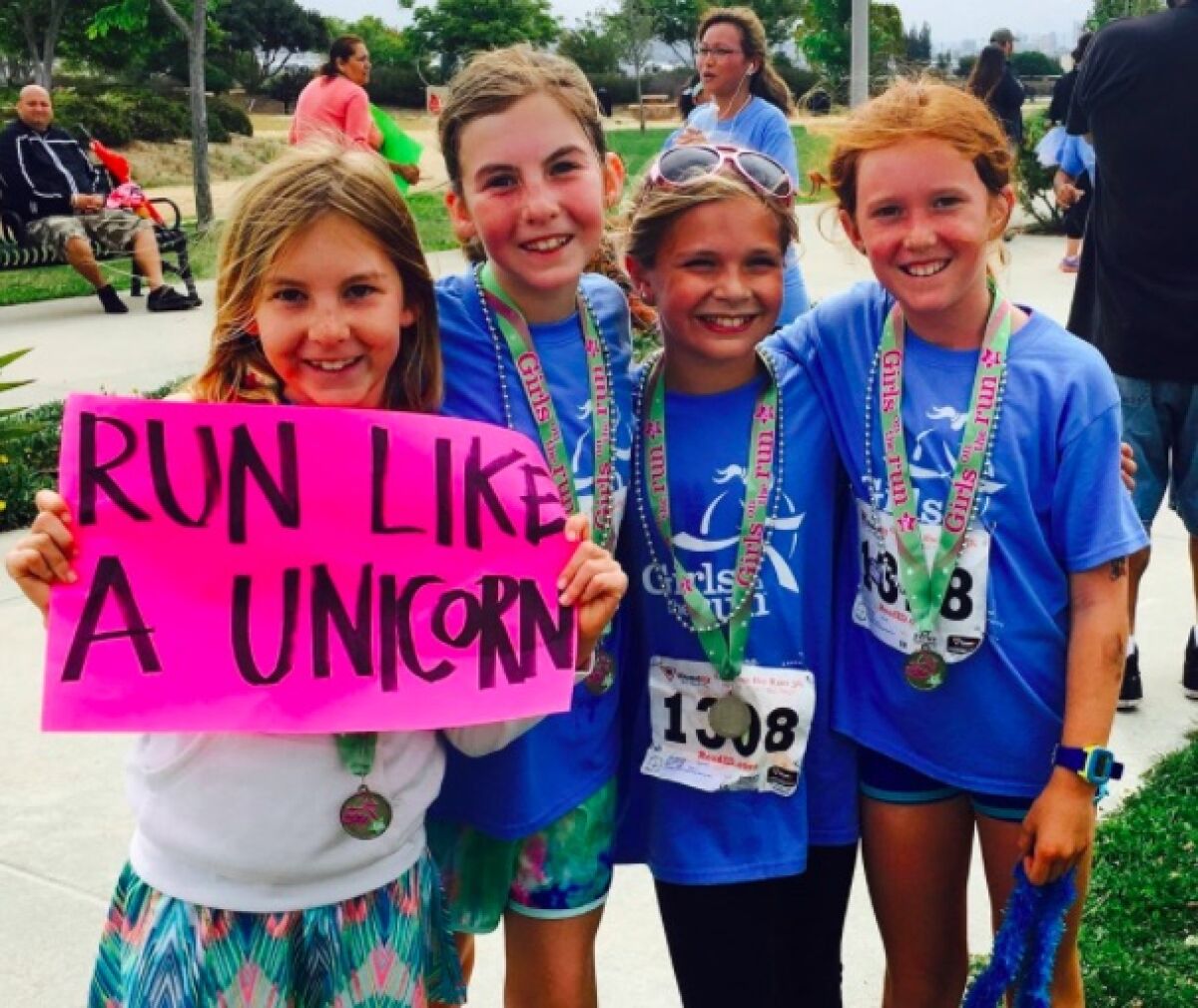 Participants in a past Girls on the Run 5K event. This year's race will be virtual May 9 through June 9.