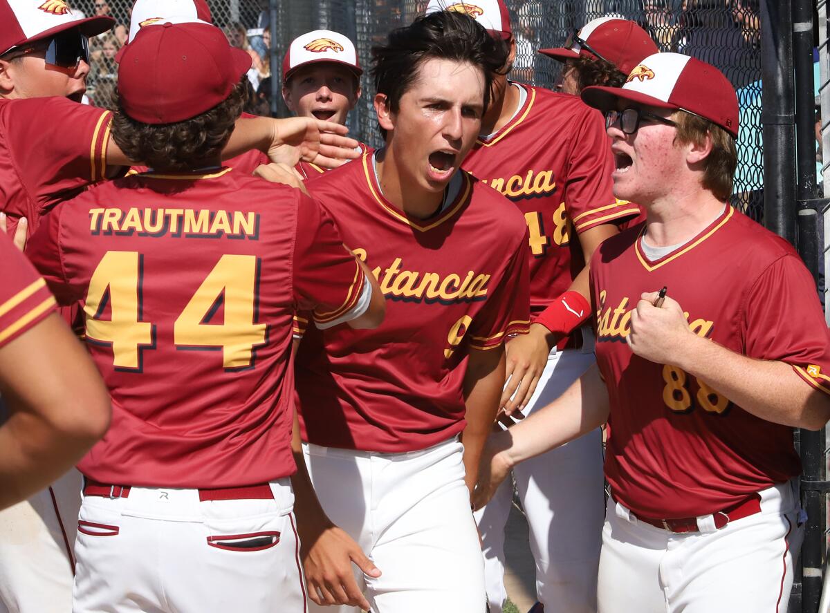 Estancia High School's Nico Viramontes (9) celebrates with his team after scoring against Rancho Mirage.