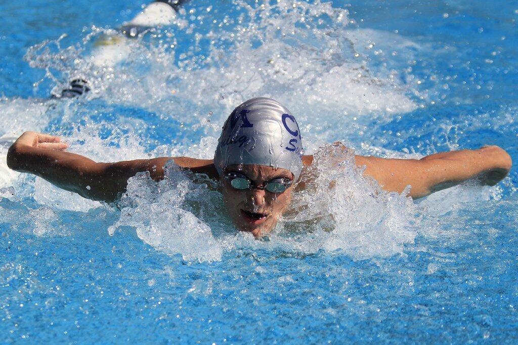 Corona del Mar High's Liam Karas competes in the boys' 200-yard individual medley during a Pacific Coast League swim meet against University in Irvine on Tuesday.