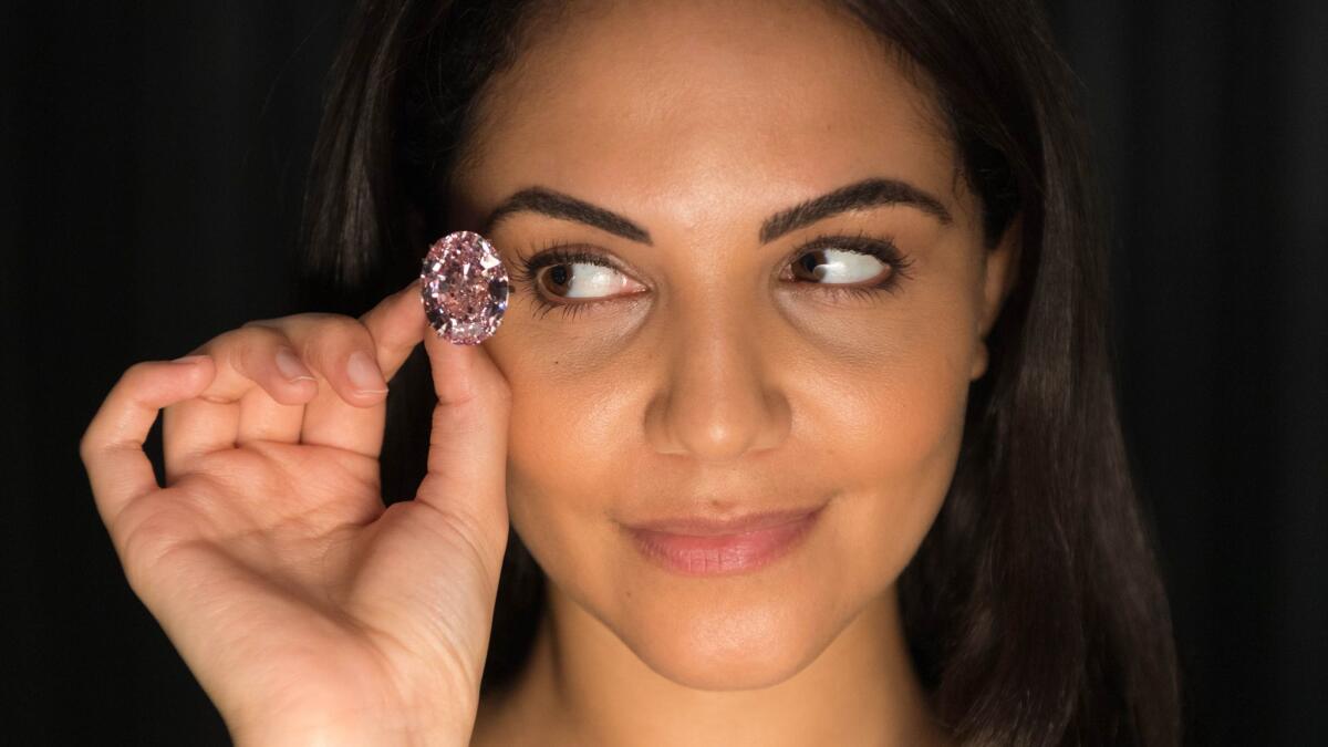 A model displays the 'Pink Star' diamond at Sotheby's on March 20, 2017 in London, England.