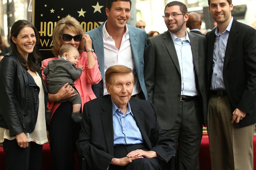 Sumner Redstone, bottom center, surrounded by family, is honored by the Hollywood Chamber of Commerce with a star on the Hollywood Walk of Fame on March 30, 2012.