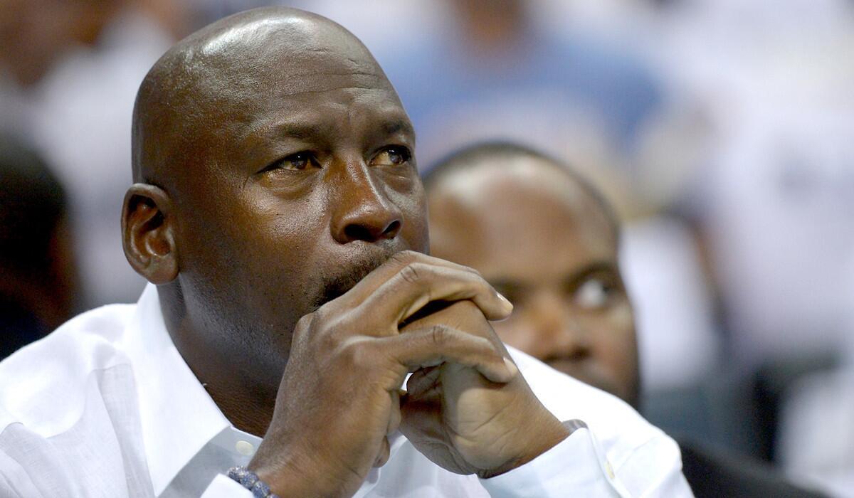 Michael Jordan watches his Charlotte Bobcats play the Miami Heat in Game 3 of their first-round playoff series.