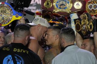 Heavyweight boxers Britain's Tyson Fury, center left, and Ukraine's Oleksandr Usyk face off during the weigh-in in Riyadh, Saudi Arabia, Friday, May 17, 2024, prior to their undisputed heavyweight championship fight on Saturday. (AP Photo/Francisco Seco)
