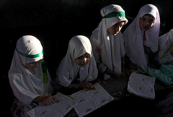 Kashmiri girls attend school in Srinagar, India, whose Muslim residents are observing the holy month of Ramadan.