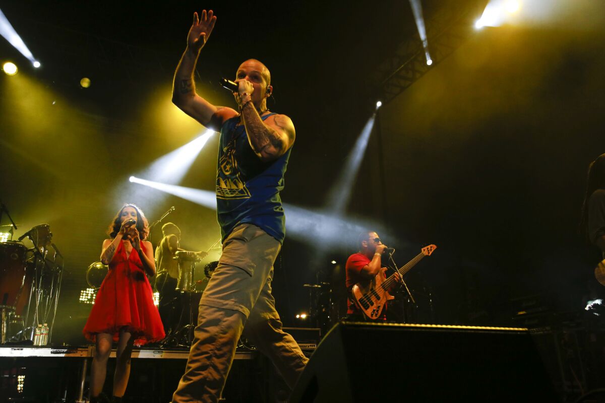 Rene Perez Joglar aka Residente, the lead singer of Calle 13, a Puerto Rican band, gets the crowd going during their set.