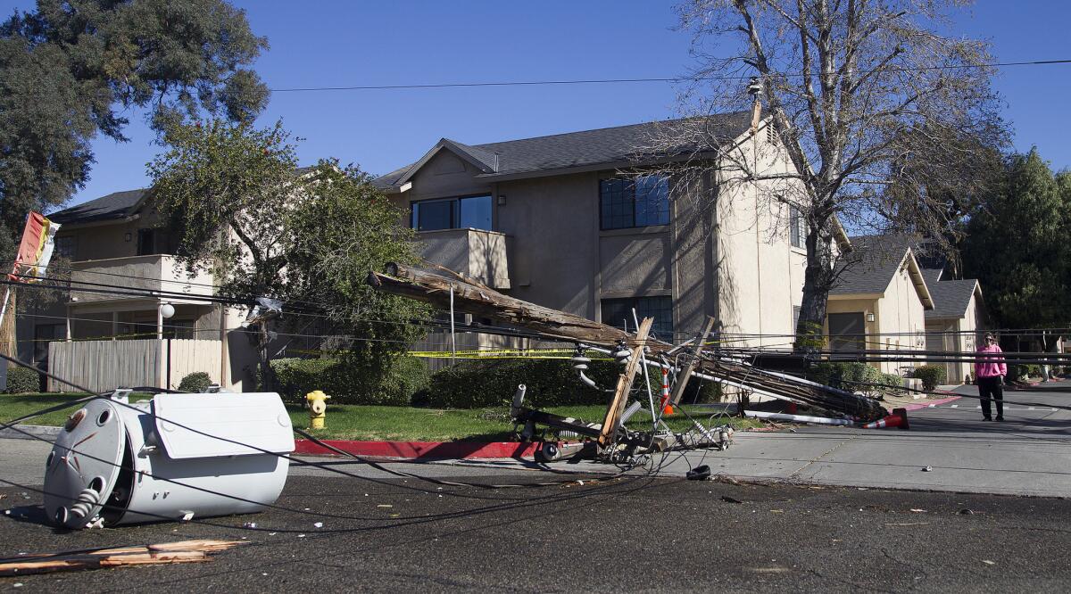 Winds up to 60 mph Saturday uprooted a tree into power lines and sending two power poles and two transformers toppling in Fontana.