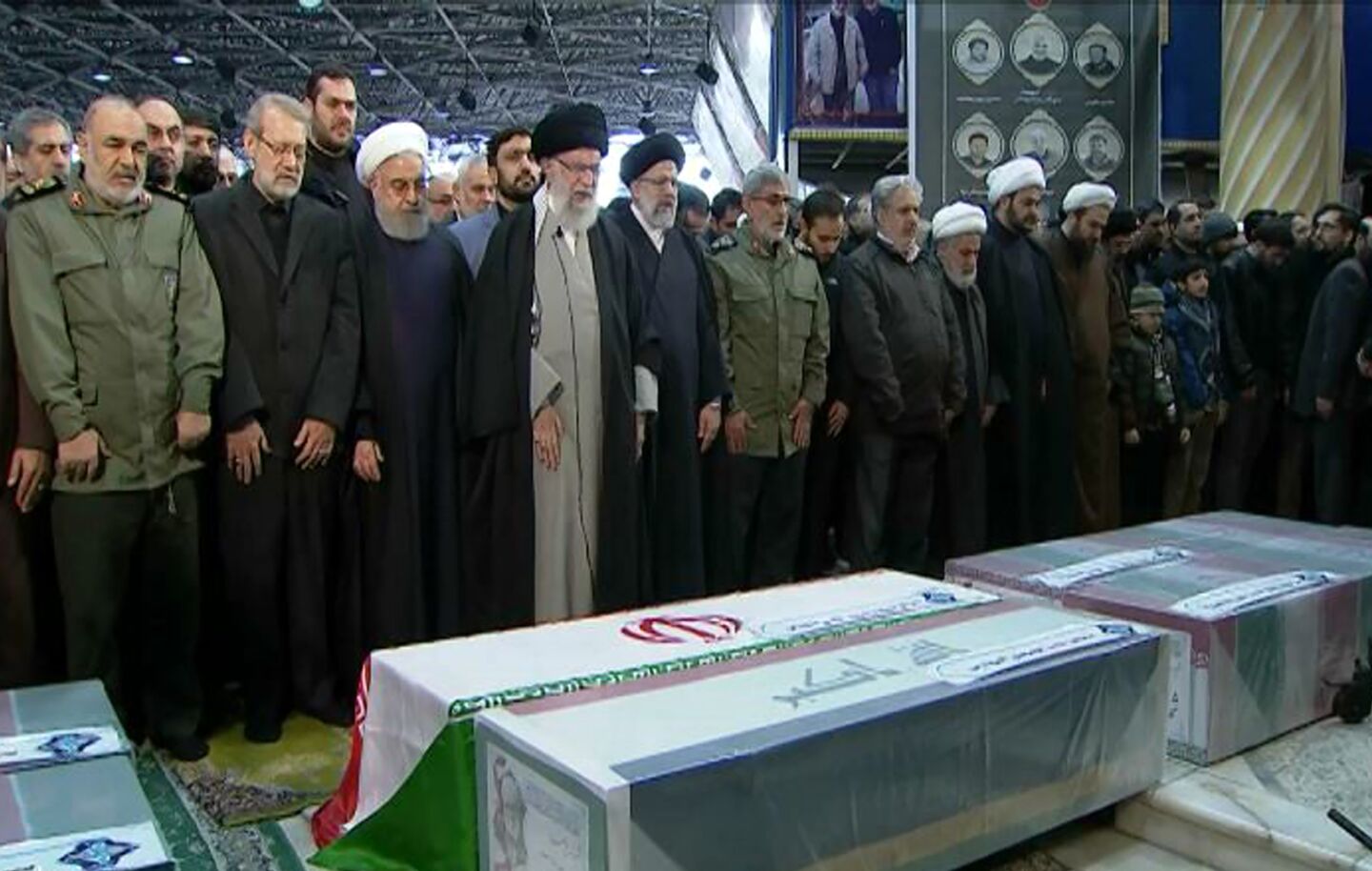 Ayatollah Ali Khamenei,, fourth from left, leads a prayer during the funeral.