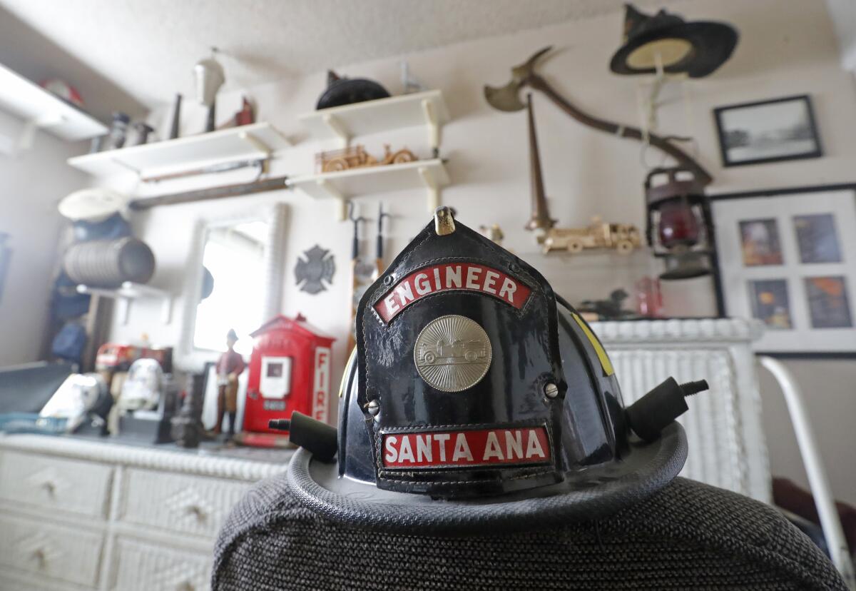A fire department hat is displayed in Bob Baker's home in Huntington Beach.