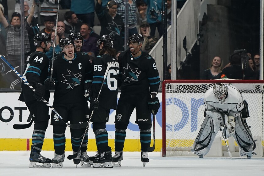 Sharks center Logan Couture celebrates with teammates after scoring a goal against the Kings on Nov. 29, 2019.