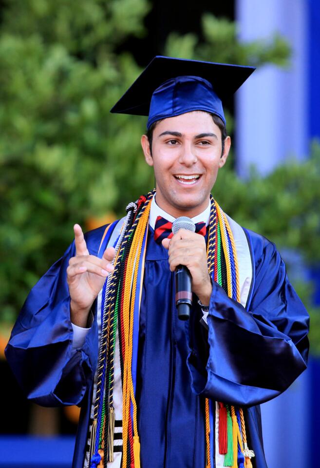 Student speaker Saahm Rohinton Aresh shares his experience as he talks during Orange Coast College's 66th Commencement Ceremony on Wednesday at Pacific Amphitheatre in Costa Mesa. (Kevin Chang/ Daily Pilot)