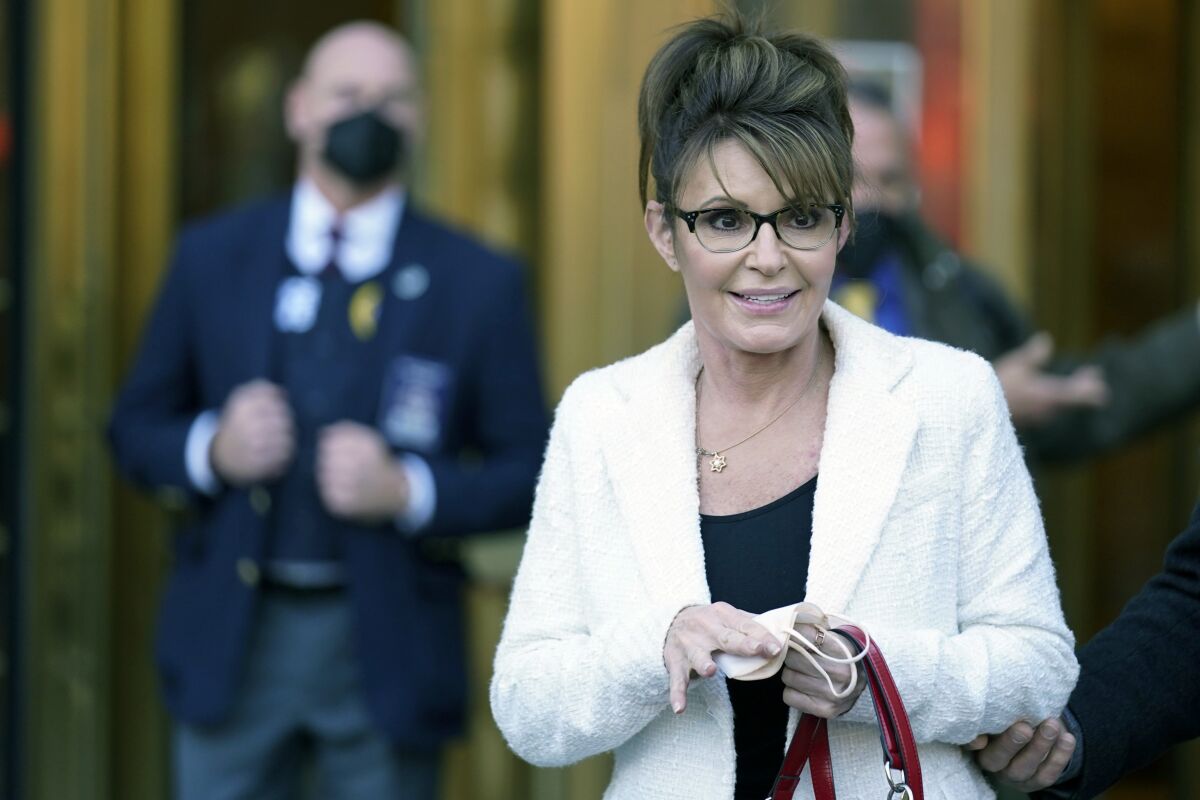 Sarah Palin walks outside