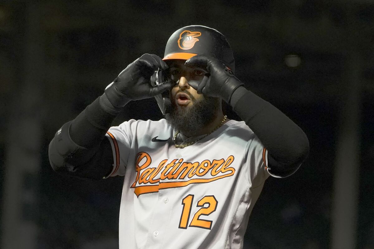 Baltimore Orioles' Rougned Odor gestures to teammates after hitting an RBI single against the Chicago Cubs during the eighth inning of a baseball game Wednesday, July 13, 2022, in Chicago. (AP Photo/Charles Rex Arbogast)