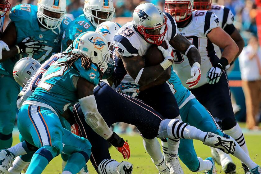 New England Patriots' Steven Jackson (39) in action during the first half against the Miami Dolphins on Sunday.