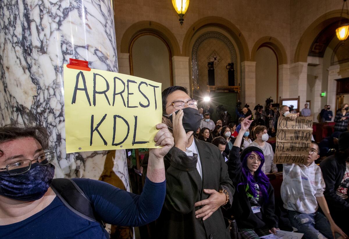 Protesters taunt Councilman Kevin de León during an L.A. City Council meeting on Dec. 13.