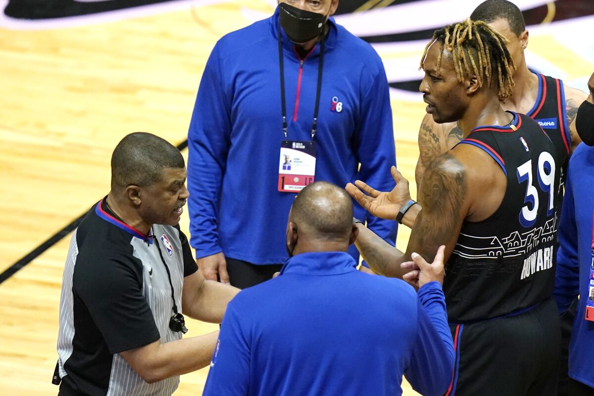 Philadelphia 76ers center Dwight Howard (39) talks with official Tony Brothers, left, after an altercation with Miami Heat forward Udonis Haslem during the first half of an NBA basketball game Thursday, May 13, 2021, in Miami. (AP Photo/Lynne Sladky)