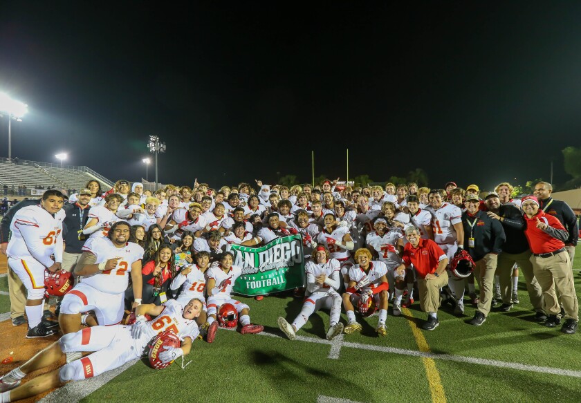 Cathedral Catholic Dons celebrate after defeating Carlsbad to take the CIF Open Division Championship.