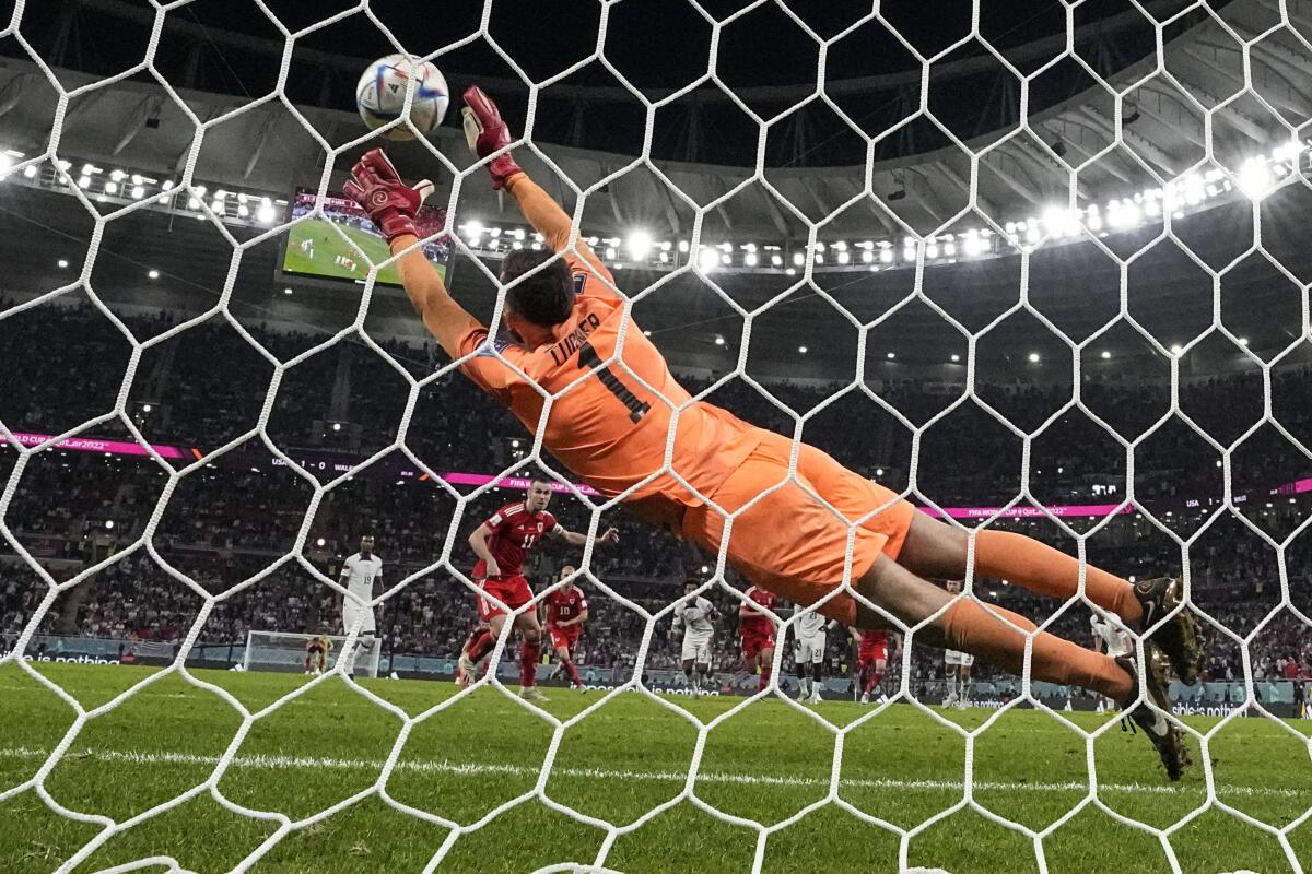 Wales' Gareth Bale scores pass U.S. goalkeeper Matt Turner to score the game in the 82nd minute.