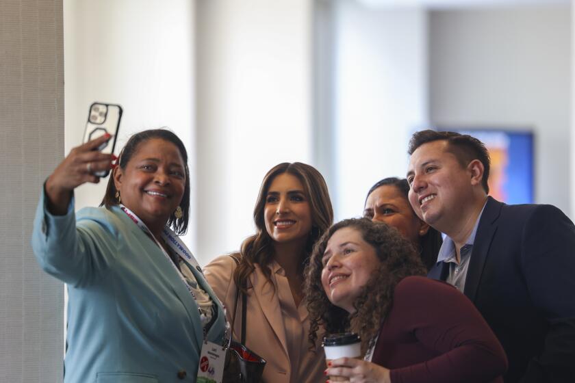 Hollywood, CA - July 11: A group of journalists take a selfie at the National Association of Hispanic Journalists 40th anniversary expo conference in Hollywood, CA on Thursday, July 11, 2024. (Zoe Cranfill / Los Angeles Times)