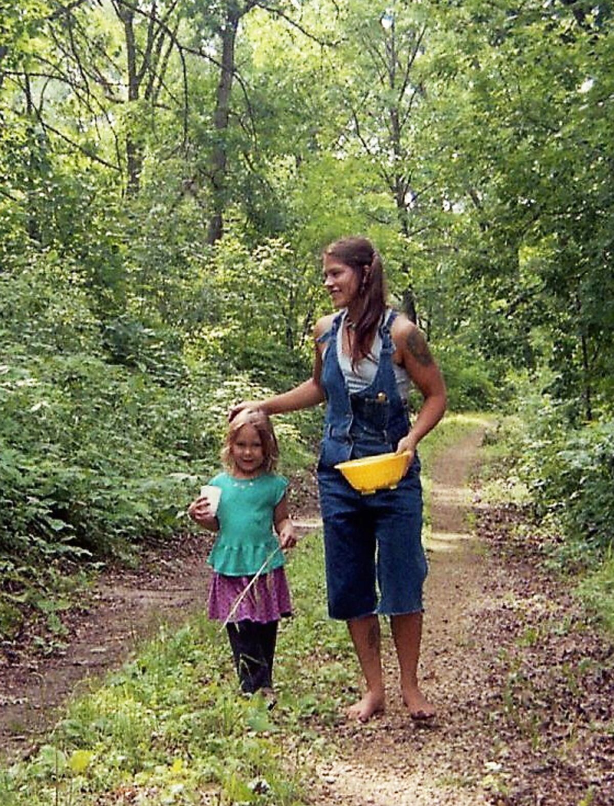 In happier times, Shyloh and Andrea Nelson while berry picking in 1993.