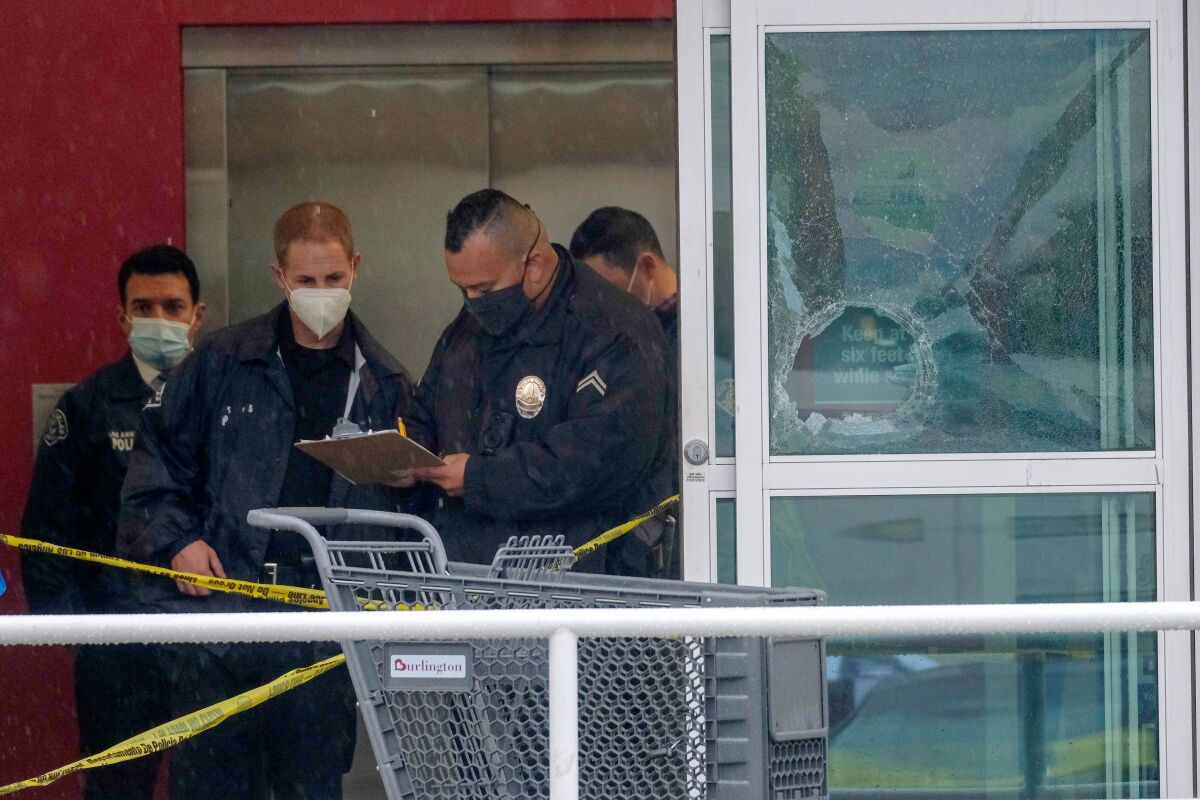 Police officers at a Burlington store after a shooting on  Dec. 23, 2021.