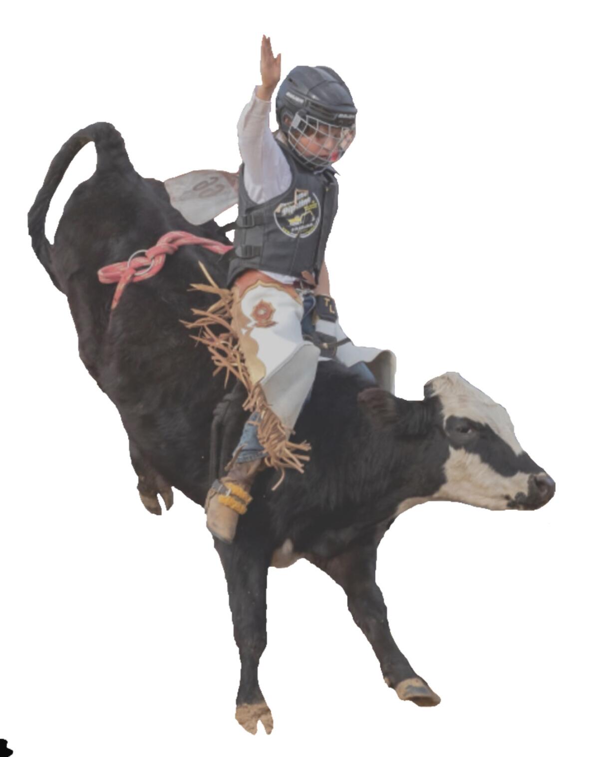 Tristan Ludwig shows off his bull-riding skills.