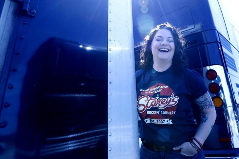 CAMARILLO, CA - APRIL 8, 2018 - Country singer Ashley McBryde enjoys a light moment outside her trailer before performing with her band at the KHAY Fest at the Camarillo airport on April 8, 2018. McBryde is a country music singer-songwriter from Arkansas and has released, "Girl Going Nowhere" and the single, "A Little Dive Bar in Dahlonega," for an upcoming album on Warner Bros. Records. (Genaro Molina / Los Angeles Times) ATTENTION PRE-PRESS: PLEASE MAINTAIN BLUISH CAST.
