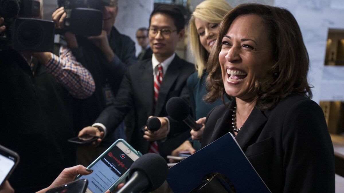 Sen. Kamala Harris speaks to reporters last month after a briefing on Capitol Hill. The junior senator from California appears to be putting in place final preparations for a run for the Democratic presidential nomination.