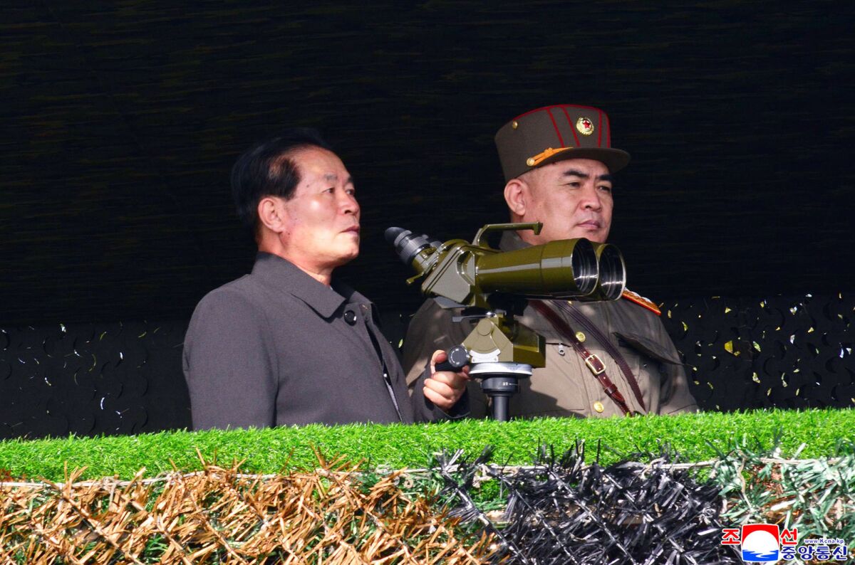 This photo provided by the North Korean government shows North Korean senior official Pak Jong Chon, left, inspects the army's artillery firing competition Saturday, Nov. 6, 2021, in undisclosed location, North Korea. Independent journalists were not given access to cover the event depicted in this image distributed by the North Korean government. The content of this image is as provided and cannot be independently verified. Korean language watermark on image as provided by source reads: "KCNA" which is the abbreviation for Korean Central News Agency. (Korean Central News Agency/Korea News Service via AP)