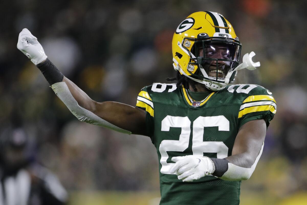 FILE - Green Bay Packers' Darnell Savage gestures to the crowd during the second half of the team's NFL football game against the Los Angeles Rams on Nov. 28, 2021, in Green Bay, Wis. The Packers should get an immediate indication of whether their defense is as stingy as its preseason billing suggests. (AP Photo/Aaron Gash, File)