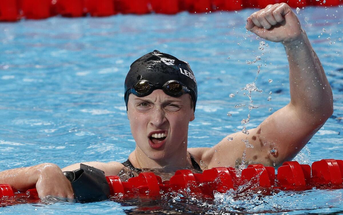 U.S. swimmer Katie Ledecky reacts after winning the women's 1,500-meter freestyle world title in record time in Kazan, Russia.