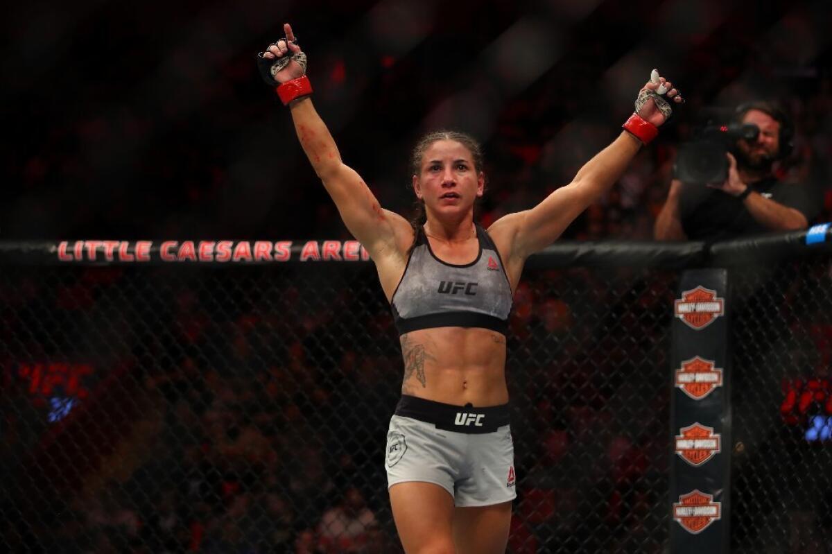 Tecia Torres celebrates after her victory over Michelle Waterson in a strawweight fight at UFC 218.