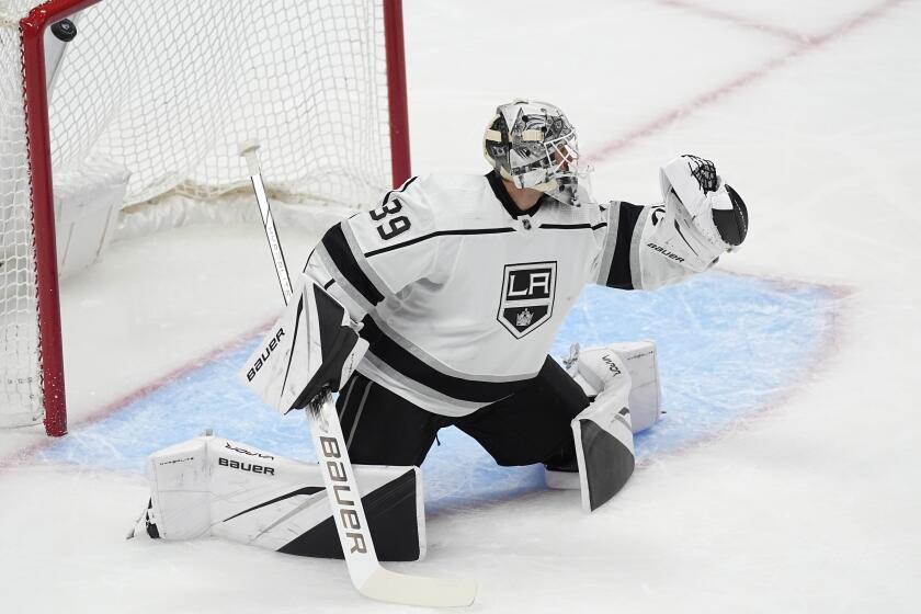 Kings goaltender Cam Talbot gives up a goal to Colorado forward Logan O'Connor during the first period Friday.
