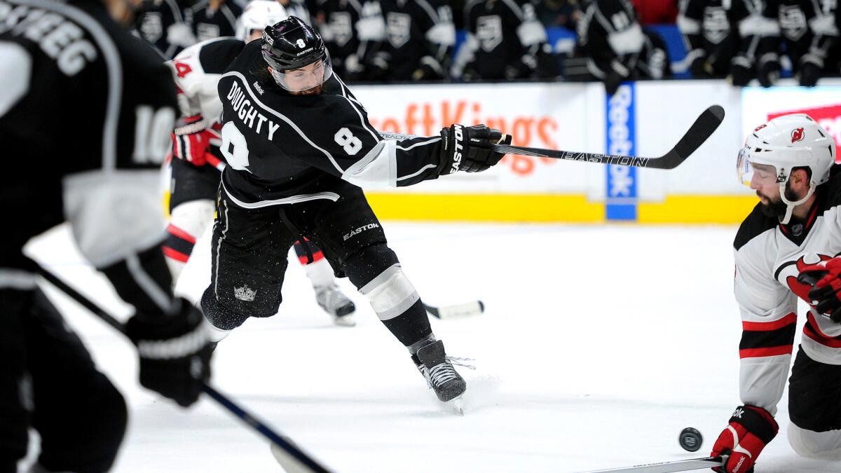Kings defenseman Drew Doughty unleashes a shot against the Devils in overtime Saturday night.